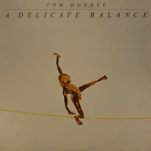 Tom Dundee — A Delicate Balance